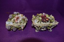 Two basket like trinket dishes or similar, having extensive floral decoration.