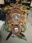 A German cuckoo clock having hunting theme.