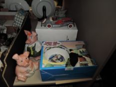 Two Natwest pigs and a model 1935 Dussenberg car also a Thomas and Friends Wedgewood bowl and mug in
