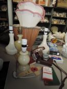 A selection of vintage lamps and shades,Tasco Binoculars, a Halina camera,Park Drive advertising