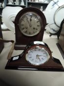 A small antique bracket or mantle clock with oak case and similar modern example