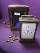 An antique carriage clock having visible escapement white enamel face with black numerals