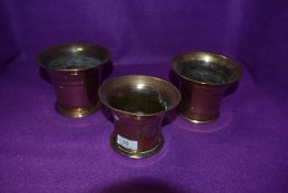 Three antique brass apothecary mortars.
