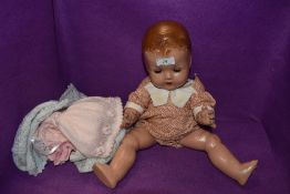 A mid century Pedigree doll having poseable limbs and sleep eyes, she even comes with a change of
