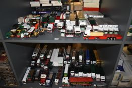 Two shelves of Corgi and similar Eddie Stobart Wagons, Trucks, Vans and similar vehicles