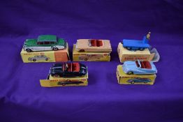 Five Dinky diecasts, Austin Atlantic Convertible in black with red interior, white tyres and red