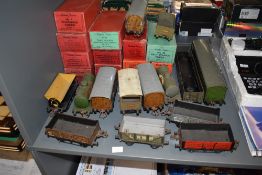 A large collection of Hornby tin plate 0 gauge rolling stock including wagons and carriages, 11 with