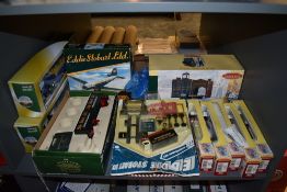 A shelf of Eddie Stobart collectables including Trackside, Cararama 1:50 scale diecast wagons, Corgi