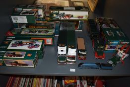 A shelf of Corgi diecast Eddie Stobart advertising wagons and trucks, 11 with boxes and 4 unboxed