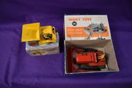 Four Dinky diecasts, Blaw Knox Bulldozer 561, Goods Yard Crane 752, Dumper Truck 962 and Elevator
