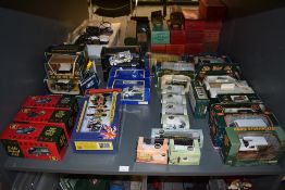 A shelf of Corgi, Vanguards, Oxford and similar Eddie Stobart vans, Cars, figures etc, all boxed