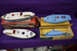 Four Sutcliffe tin plate and clockwork model boats, Bluebird, Comet and Unda Wunda, all boxed and