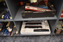 Two shelves of Lima 0 gauge including 0-6-0 LMS Loco 7 Tender, SNCF Locomotive, four carriages and