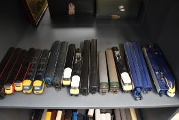 A shelf of mixed vintage Hornby 00 gauge Virgin, Intercity, DMU and Eurostar Locomotive and Carriage
