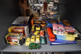 A shelf of modern toys including Burago, Corgi, Matchbox, Scalextric etc