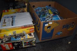 A shelf of vintage Lego including Legoland part sets 6080, 6363, 6030, 6821, 897, Technics part