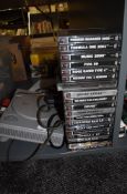 A Sony Playstation with two controllers and various games including Colin Mcrae Rally 2.0, Premier