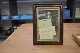 A framed photograph, 1930's English cricketer Douglas Jardine along with a business card bearing