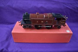 A Hornby 0 gauge clockwork 4-4-2 Tank Engine in LMS maroon and black livery, numbered 2180, in