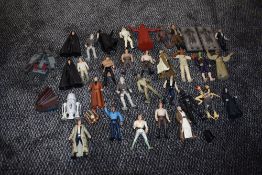 A shelf of LFL Kenner and similar Star Wars figures and accessories including Chewbacca, Luke Sky