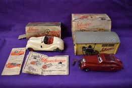 Two Schuco tin plate and clockwork toys, Garage no1500 with Telephone and Kommando Anno 2000 car