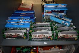 A shelf of 18 Eddie Stobart diecast wagons including Oxford Super League, Corgi Super Haulers, Saico