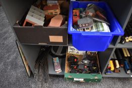 Two shelves of Hornby and similar 00 gauge buildings, track and accessories including two boxed