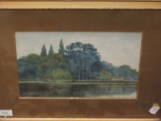 A watercolour, lakeside woodland cottage, 17 x 26cm, framed and glazed