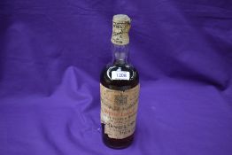 A 1929 bottle of John Dewar and Sons White Label Finest Scotch Whisky of Great Age with spring
