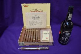 A bottle of DelaForce Sons & CA Finest Vintage Port 1975, 75cl along with a Don Tomas Cigar box
