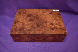 A French modern birdseye maple humidor having Hygromertre inside