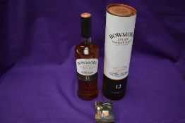 A bottle of Bowmore Islay Single Malt Scotch Whisky, aged 12 Years, 700ml, 40% Vol, in card tube