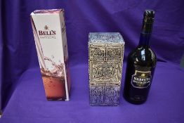 A bottle of Chivas Regal 12 Year Old Whisky 26 2/3 Fl Oz 75% proof, a bottle of Bells 8 year old