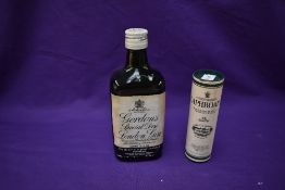 A bottle of Gordon's Special Dry London Gin 13 1/3Fl Ozs 70% proof and a miniature bottle of