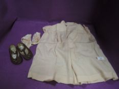 Two pairs of baby shoes and a smock dress, around 40s/50s.