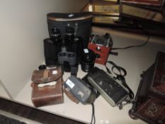 A mixed lot of cameras including instamatic 50 ,binoculars and GPO volt meter or similar.