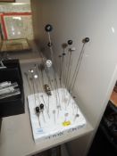 A collection of hatpins and a stick pin, Edwardian onwards, various lengths and styles.