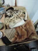 A box of vintage fur and other accessories including mink stole, gloves and more.