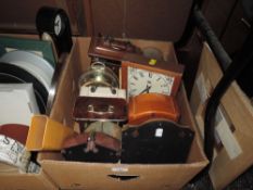 An assortment of clocks, various styles and sizes.