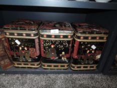 Three large oriental style tea tins.