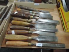 A selection of wood or cabinet makers flat spade and rounded turners or carvers chisels