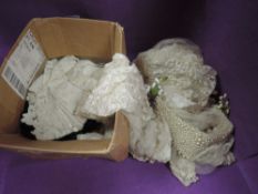 A vintage wedding veil with beading and was flowers AF and a selection of lace and similar.