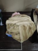 A selection of Faux fur items and a dyed coney pom-pom scarf.
