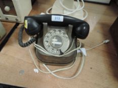 An early telephone set having copper body and bakelite reciever