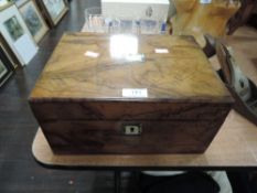 An antique writers compendium or slope having foreign wood case and mother of pearl inlay