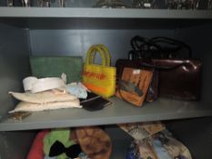 A collection of vintage handbags, handkerchief case and handkerchiefs,collars,compact and more.