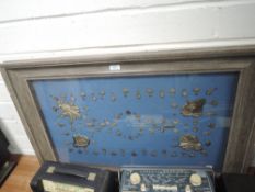 A well framed set of antique military or royal regalia adornments possibly casket or equine related