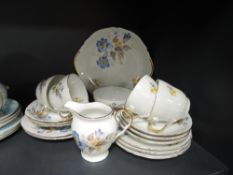 A part tea service by Durham China with floral design