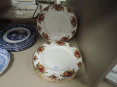 A set of six dinner plates by Old Country Roses