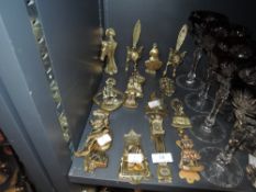 A varied lot of brass door knockers including foxes, Harrow school, horses and more, thirteen in